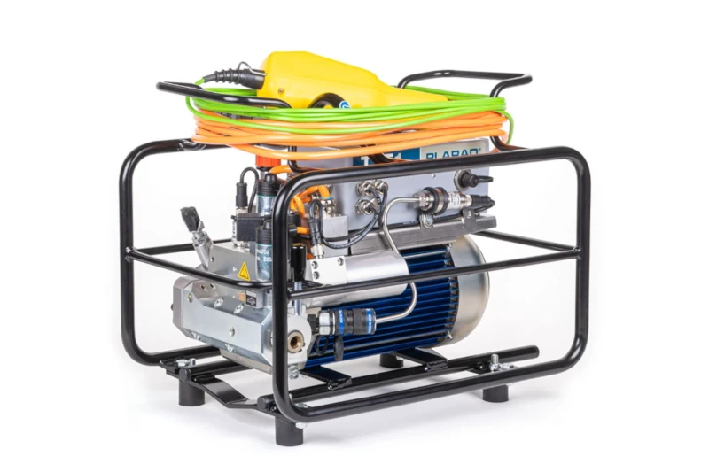 Portable industrial power pack with cables and metal frame, likely a high-pressure pump or compressor, showcasing Schraubtechnik und Drehmomentschrauber Made in Germany quality.